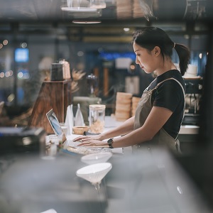 Waitress working on her laptop