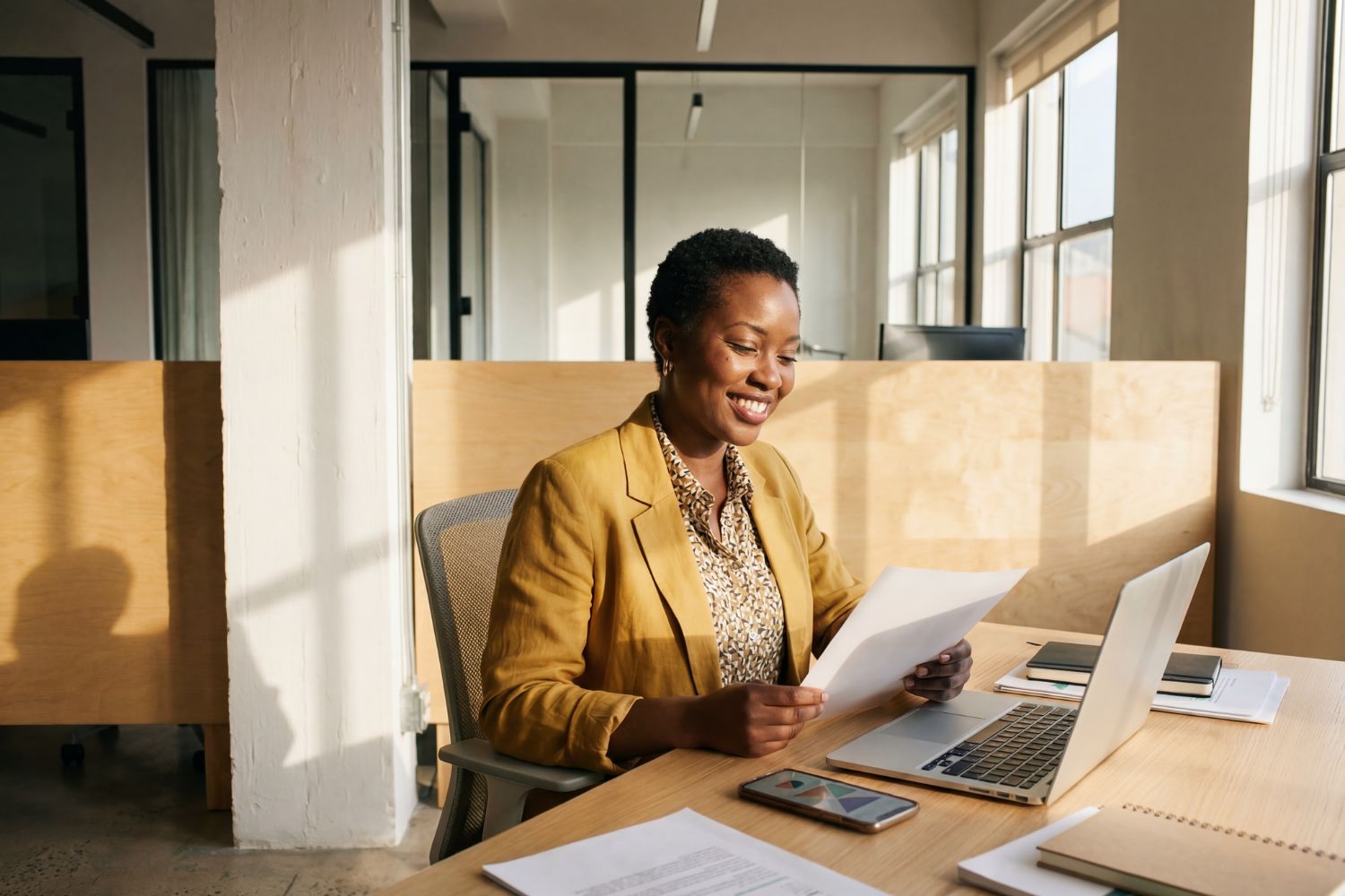 Manager reviewing employee time-off requests at a desk